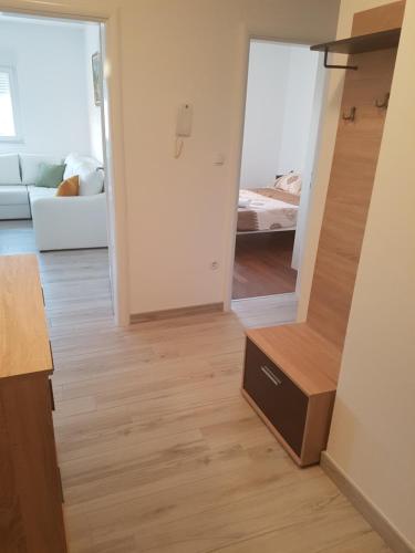 Postel nebo postele na pokoji v ubytování Apartman Lora