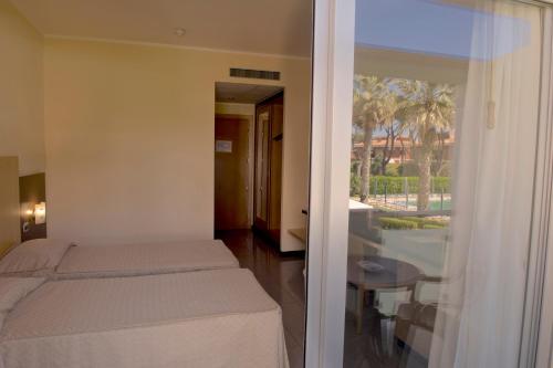Postel nebo postele na pokoji v ubytování Albergo Mediterraneo