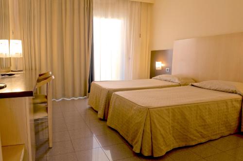 Katil atau katil-katil dalam bilik di Albergo Mediterraneo