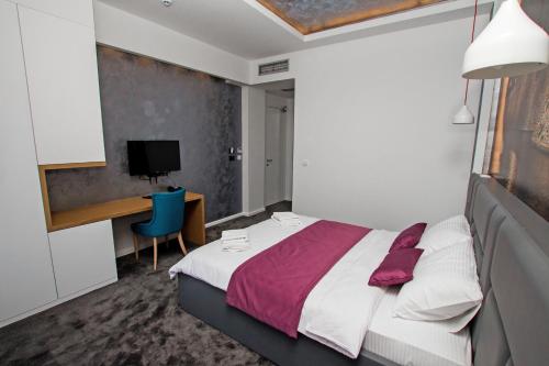 Ein Bett oder Betten in einem Zimmer der Unterkunft Hotel Alkima