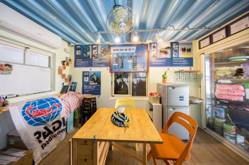 a room with a bed and a table in it at Fire Island Guest House in Green Island
