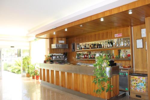 a bar in a restaurant with a lot of alcohol at Hotel Fabiola in Giulianova