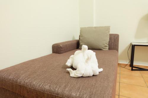 Ένα ή περισσότερα κρεβάτια σε δωμάτιο στο Lomsabai Apartments