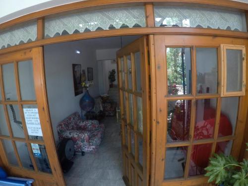 a living room with a large glass door at Apartments Zafiria in Ágios Konstantínos