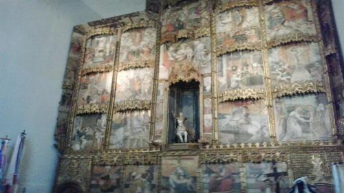 a large painting on the wall of a church at B&B Pani Silvio in Perfugas