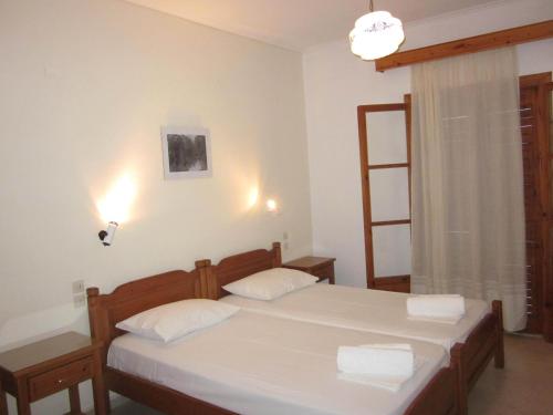 מיטה או מיטות בחדר ב-Kolios View