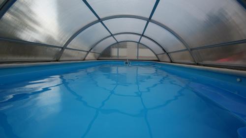 a pool of water in a metal building at Hotel Restaurant Stöckl in Bad Deutsch Altenburg