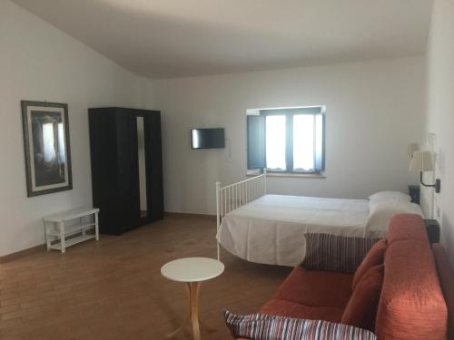 Postel nebo postele na pokoji v ubytování Appartamenti Il Criollo