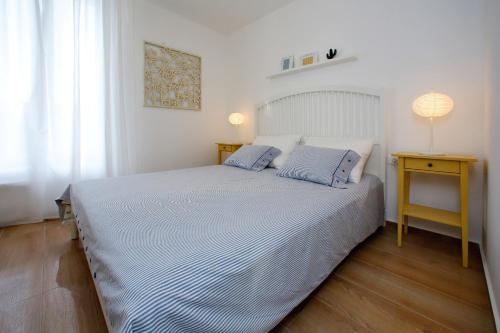Postel nebo postele na pokoji v ubytování L apartments