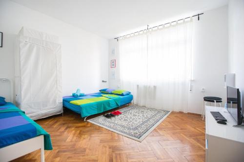 Posteľ alebo postele v izbe v ubytovaní Center eazZynight 2