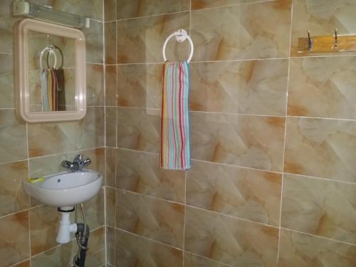 a bathroom with a sink and a mirror at Riad Espagne in Marrakech