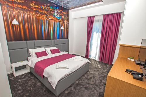Ein Bett oder Betten in einem Zimmer der Unterkunft Hotel Alkima
