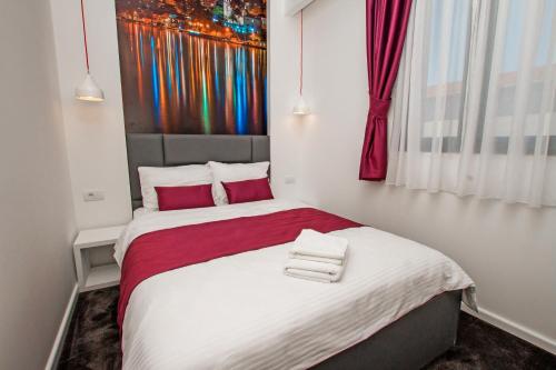 Ein Bett oder Betten in einem Zimmer der Unterkunft Hotel Alkima