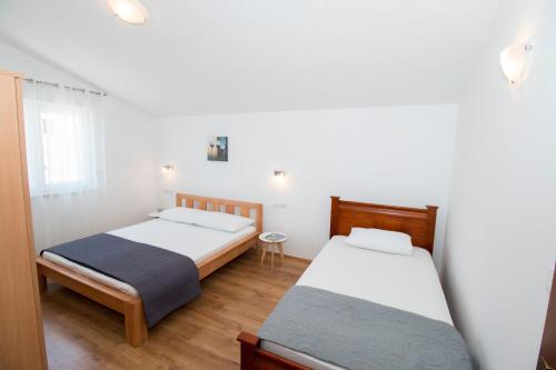 Posteľ alebo postele v izbe v ubytovaní Apartments Liber