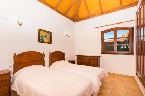 Postel nebo postele na pokoji v ubytování Villa Corralejo Beach