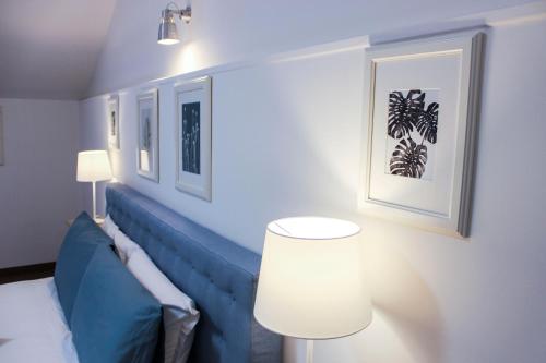 a room with a bed and a table and a lamp at Aduepassi apartments in Manfredonia