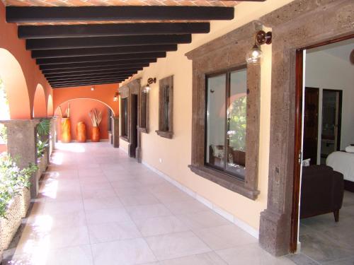 a corridor of a house with a ceiling at Hotel Casa Don Quijote in San Miguel de Allende