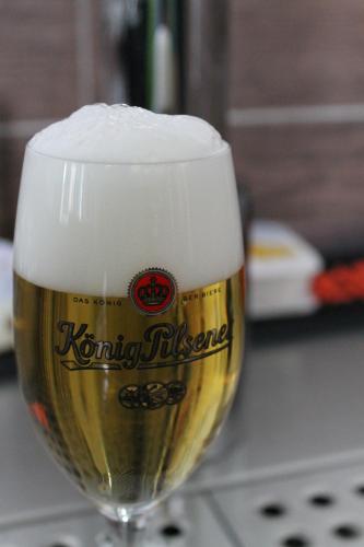 a glass of beer sitting on a table at Leezdorfer Hof in Leezdorf