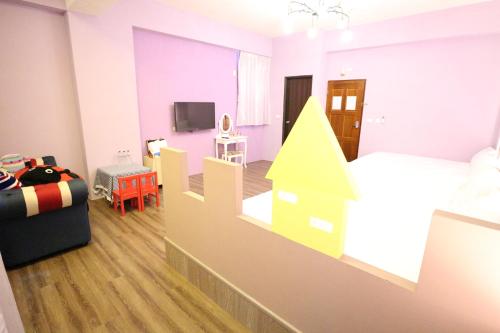 Un televizor și/sau centru de divertisment la Aunt's Bed and Breakfast