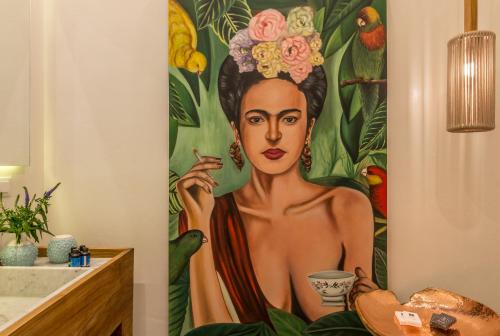 a painting of a woman in a shower curtain in a bathroom at Nyx Chic Manor in Chania Town