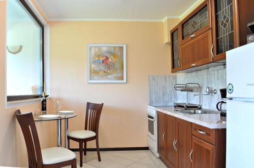 A kitchen or kitchenette at St George Apartment