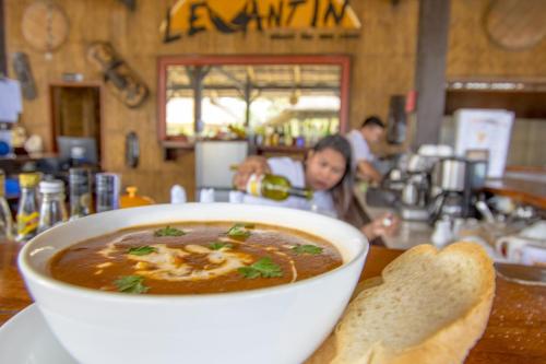 a bowl of soup sitting on top of a table at Levantin Boracay in Boracay