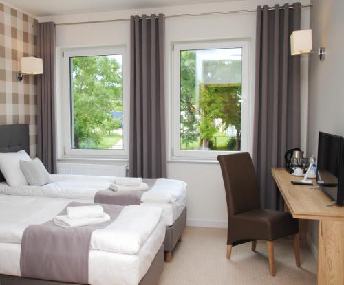 Posteľ alebo postele v izbe v ubytovaní Hotelik 51