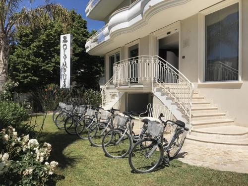 a bike parked in front of a house at Olympus Resort in Alba Adriatica