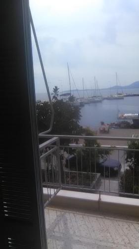 a view of a harbor from a hotel balcony at Giannis Rooms in Methana
