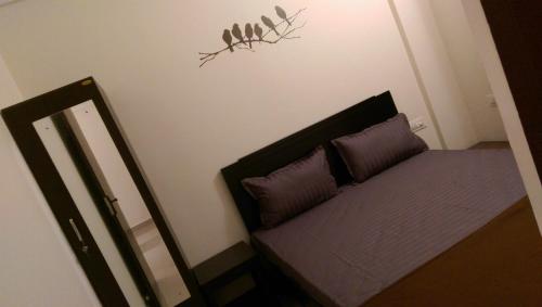 Postel nebo postele na pokoji v ubytování Tranquil Serviced Apartments