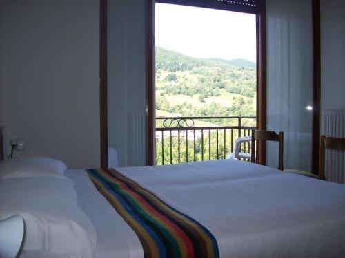 Ein Bett oder Betten in einem Zimmer der Unterkunft Hotel Valle Intelvi