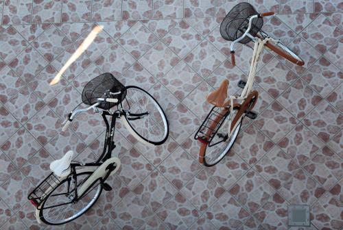 two bikes parked on a tiled floor at Villa Giulia&Gaia - Guest House in Nardò