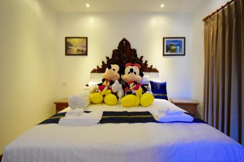 Кровать или кровати в номере Siam Sunrise Seaview
