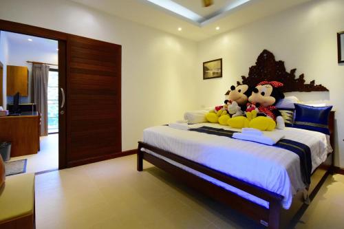 Кровать или кровати в номере Siam Sunrise Seaview