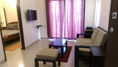 TV a/nebo společenská místnost v ubytování Tranquil Serviced Apartments