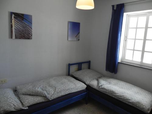 Llit o llits en una habitació de Bungalows & Apartamentos Morani