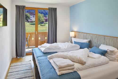 a bedroom with two beds with pillows on it at Residenz Drachenstein Wildschönau in Niederau