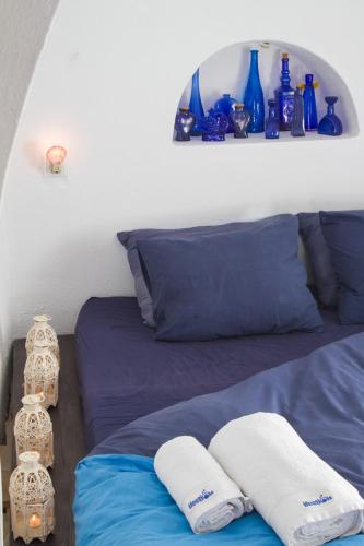 Postel nebo postele na pokoji v ubytování Ifestio Villas Oia