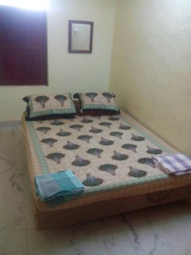 a large bed in a room with sidx sidx sidx at Raghavi Tourist Home in Kanyakumari