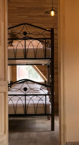 two iron bunk beds in a room with a window at Freedom in Uzhhorod