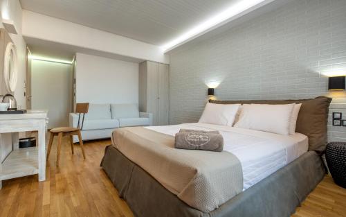 a bedroom with a large bed in a room at The Secret Boutique Hotel in Lefkada