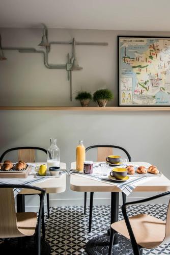 two tables in a restaurant with food on them at ANNEXE 1888 in Magland