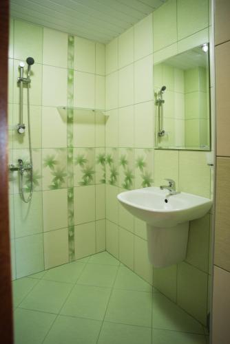 a bathroom with a sink and a mirror at Guest House Georgievi in Primorsko