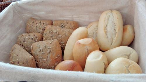 a basket filled with lots of different types of bread at Hotel Morgana in Marina di Carrara