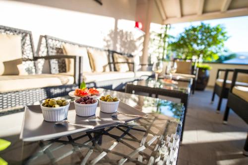 a tray with three bowls of fruit on a table at Hotel CampingPark Steiner in Laives