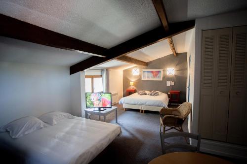 Postel nebo postele na pokoji v ubytování Les Jardins de L'Ocean