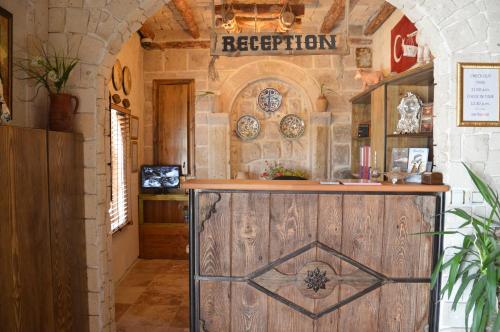 an entrance to a restaurant with a wooden door at Elite Cave Suites in Goreme
