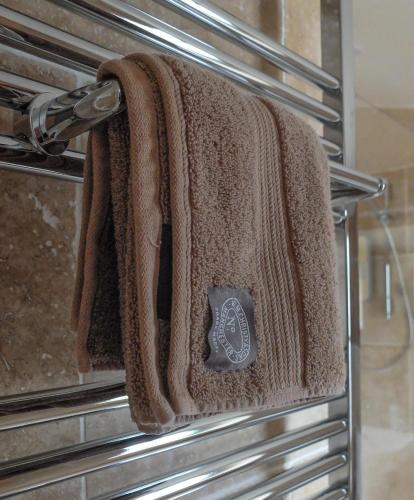 a towel is hanging on the door of an oven at Pippin Heath House B&B in Holt