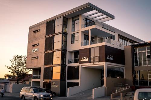 a building with a car parked in front of it at iKON Self-Catering in Windhoek