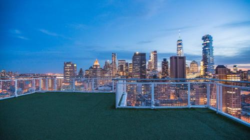 a view of a city skyline at night at NoMo SoHo in New York